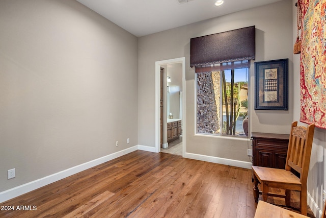 unfurnished room with light wood-type flooring