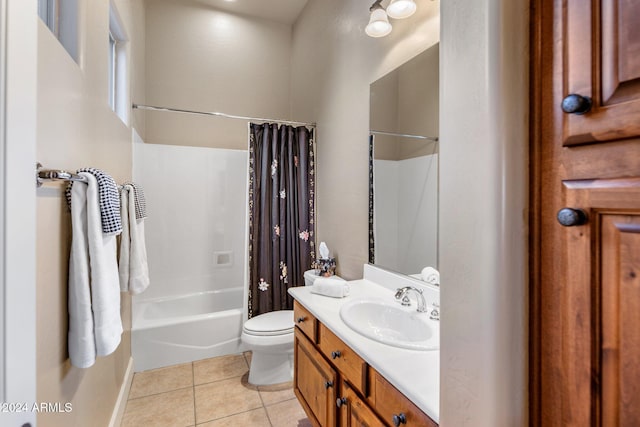 full bathroom with tile patterned flooring, vanity, shower / tub combo with curtain, and toilet