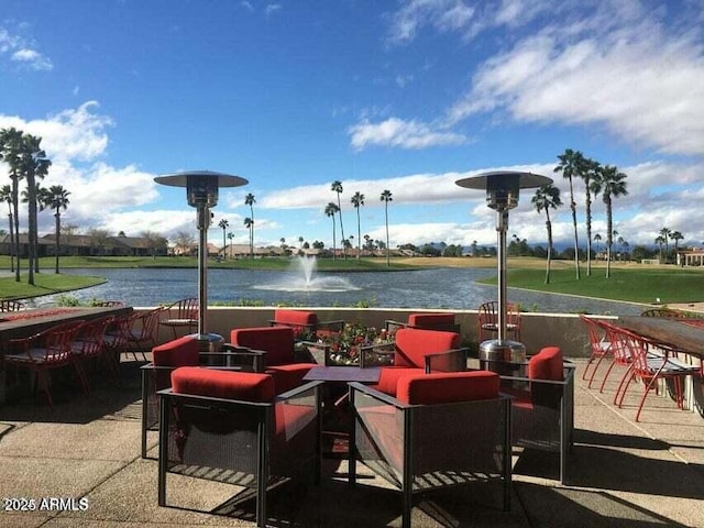 view of patio with a water view