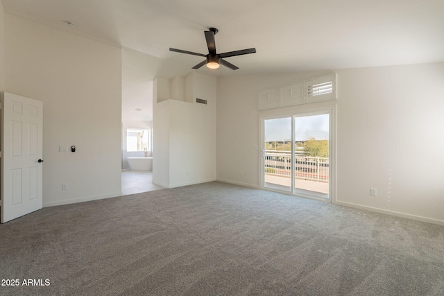 3837 E Windsong Dr, Phoenix, AZ 85048 - spare room featuring a ceiling fan, high vaulted ceiling, carpet flooring, and plenty of natural light