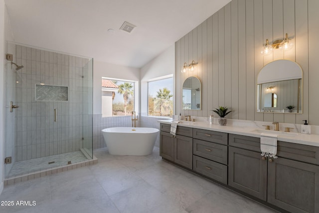 3837 E Windsong Dr, Phoenix, AZ 85048 - full bath featuring lofted ceiling, a shower stall, double vanity, and a soaking tub