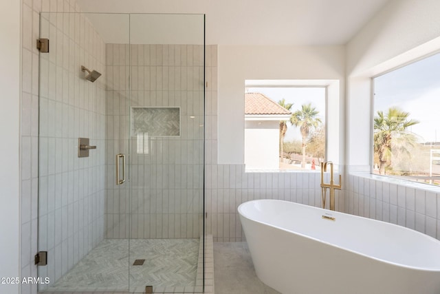 3837 E Windsong Dr, Phoenix, AZ 85048 - full bathroom with a freestanding bath, a stall shower, and tile walls