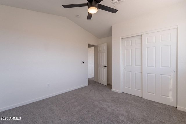 3837 E Windsong Dr, Phoenix, AZ 85048 - unfurnished bedroom featuring carpet flooring, vaulted ceiling, a closet, baseboards, and ceiling fan