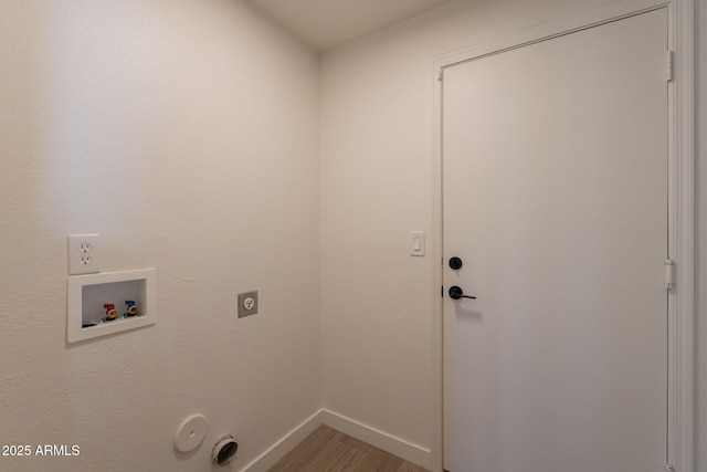 3837 E Windsong Dr, Phoenix, AZ 85048 - laundry room with hookup for an electric dryer, washer hookup, light wood-type flooring, hookup for a gas dryer, and baseboards