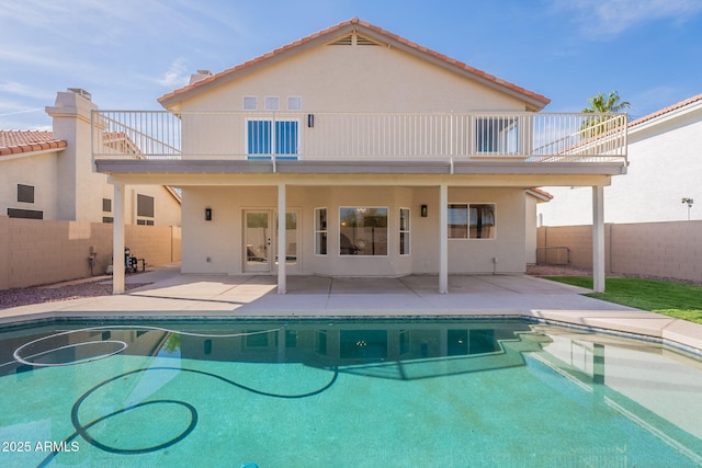 3837 E Windsong Dr, Phoenix, AZ 85048 - rear view of house featuring a balcony, a fenced backyard, and stucco siding