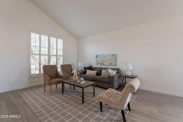 3837 E Windsong Dr, Phoenix, AZ 85048 - living room with light wood-style flooring, baseboards, and vaulted ceiling