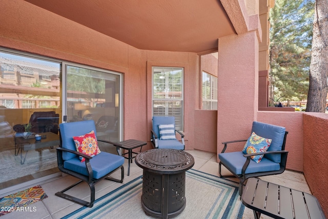 view of patio featuring a balcony