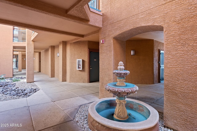 corridor with arched walkways