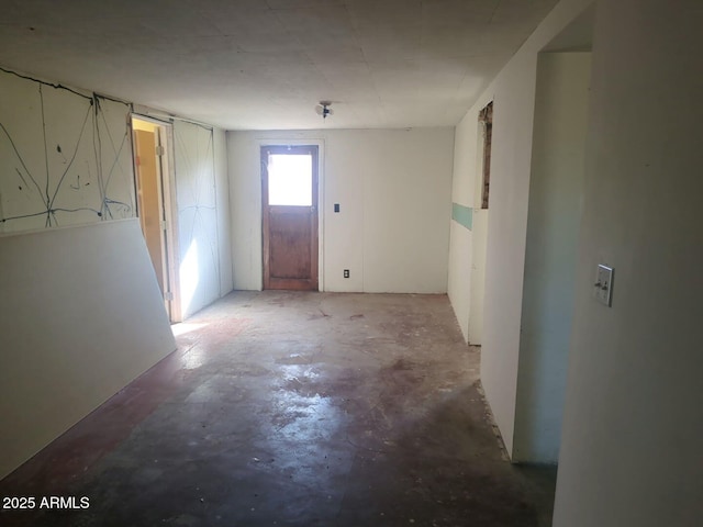 entrance foyer with unfinished concrete floors