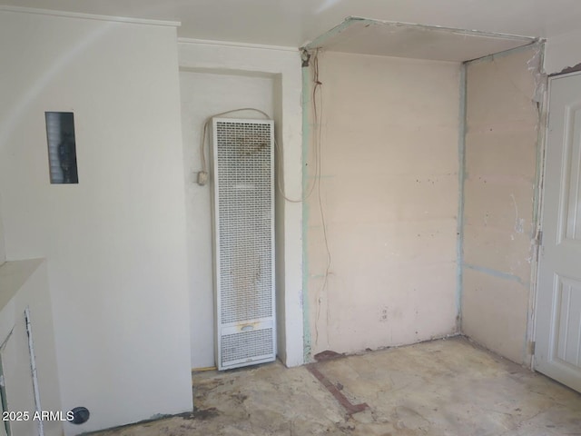 interior space featuring concrete floors and a heating unit