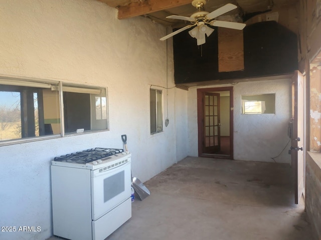 interior space with a patio area and ceiling fan