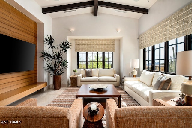 living area with visible vents and vaulted ceiling with beams