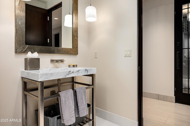 bathroom with baseboards
