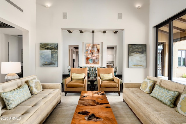 living area with a towering ceiling