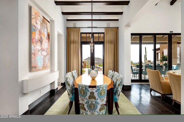 dining room with beamed ceiling, dark wood-style floors, and french doors