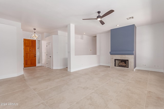 unfurnished living room featuring ceiling fan