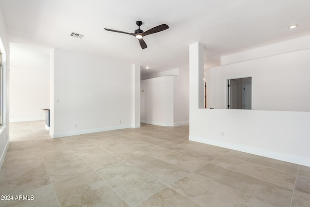 tiled empty room with ceiling fan