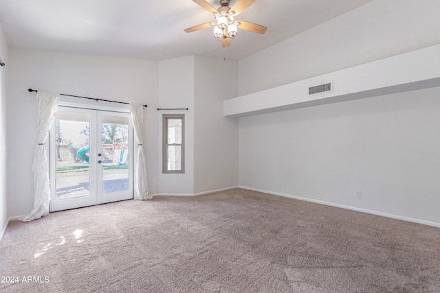 unfurnished room featuring ceiling fan, light carpet, and french doors