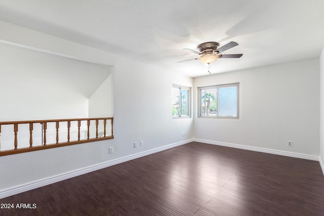 empty room featuring ceiling fan and dark hardwood / wood-style floors