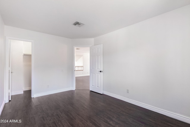 spare room featuring dark hardwood / wood-style flooring