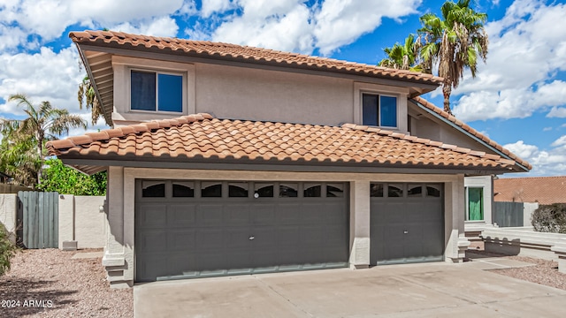 mediterranean / spanish-style home featuring a garage