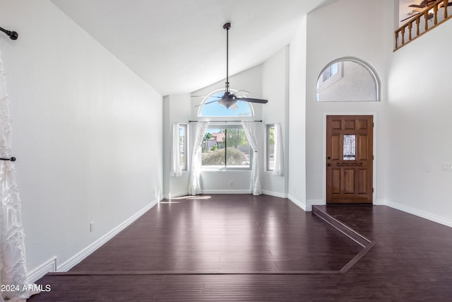 entrance foyer featuring dark hardwood / wood-style flooring, ceiling fan, and high vaulted ceiling