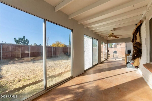 unfurnished sunroom with beamed ceiling and ceiling fan