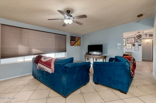 tiled living room with a textured ceiling and ceiling fan