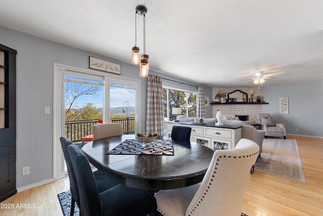 dining area featuring ceiling fan and light hardwood / wood-style flooring