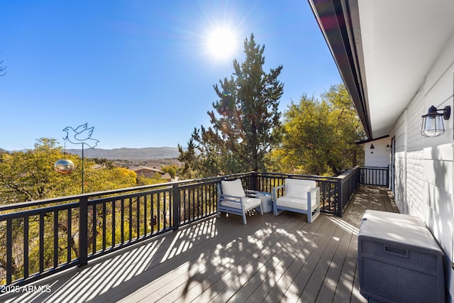 wooden terrace featuring a mountain view