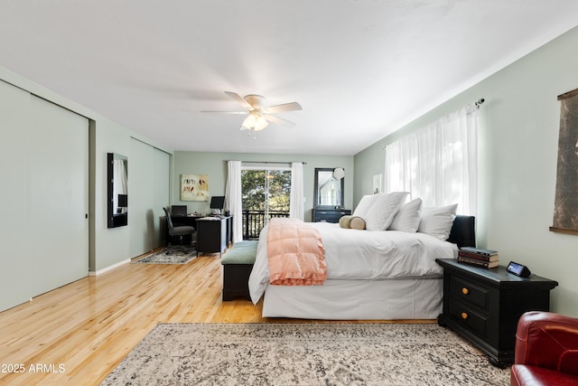 bedroom featuring ceiling fan, access to exterior, and hardwood / wood-style floors