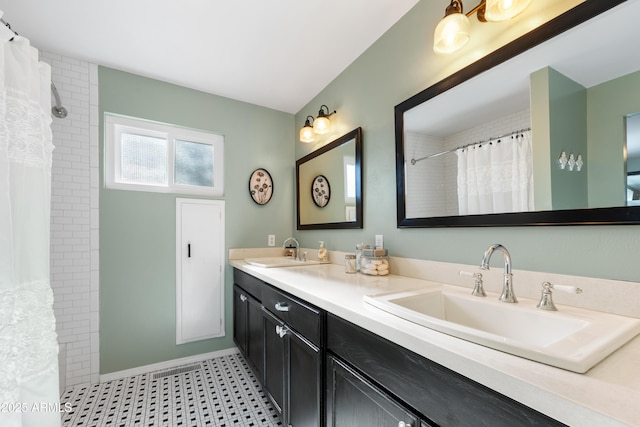 bathroom featuring vanity and a shower with curtain