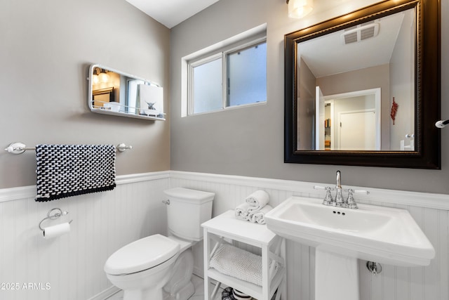 bathroom featuring sink and toilet