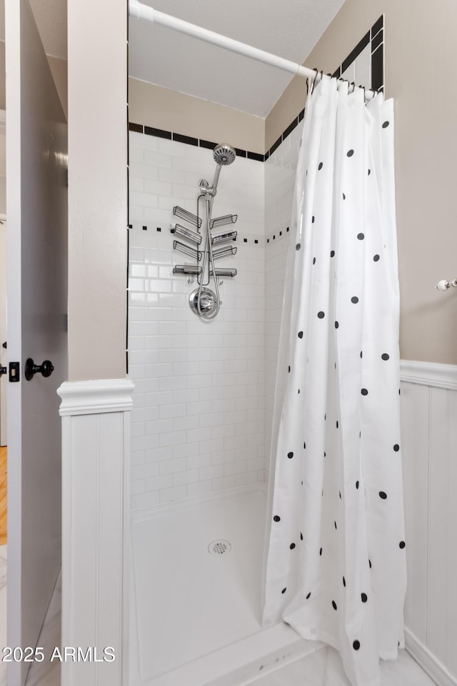 bathroom with a shower with curtain