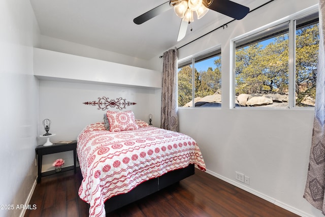 bedroom featuring dark wood-type flooring and ceiling fan