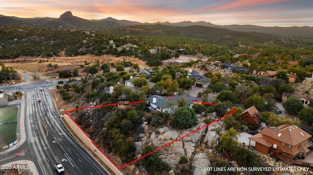 aerial view at dusk with a mountain view