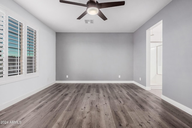 empty room featuring hardwood / wood-style flooring and ceiling fan