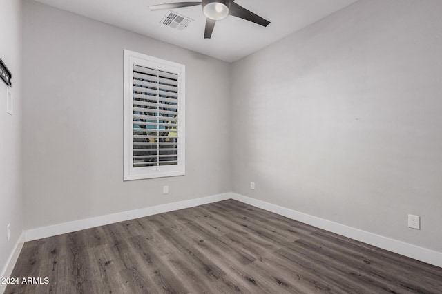 unfurnished room featuring ceiling fan and dark wood-type flooring