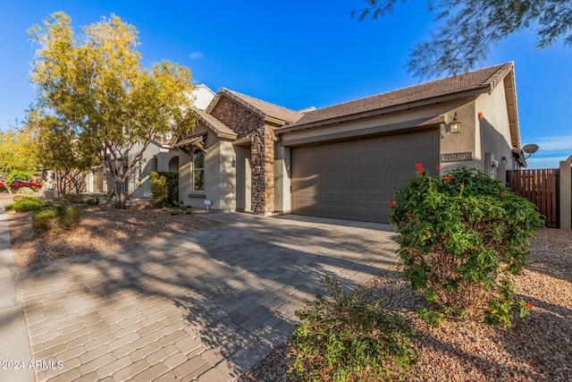 ranch-style home featuring a garage