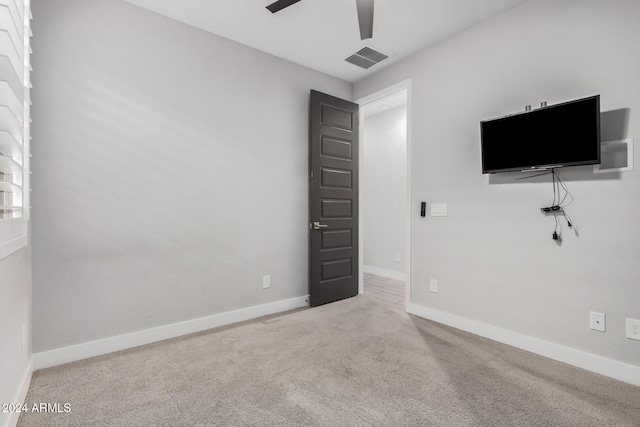 unfurnished bedroom featuring carpet flooring and ceiling fan