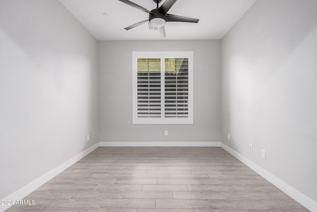 unfurnished room featuring ceiling fan and light wood-type flooring