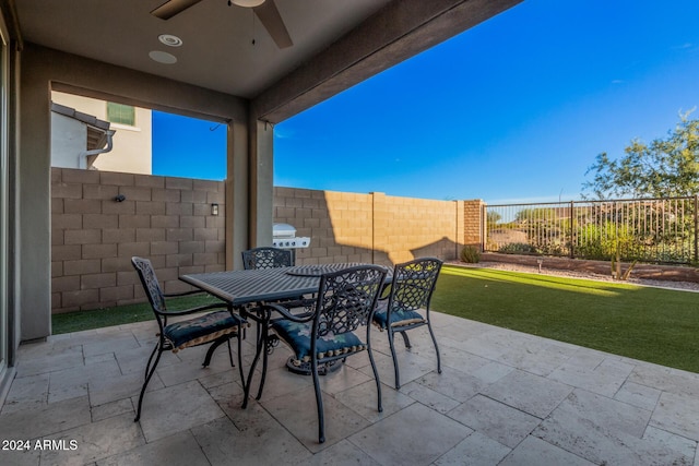 view of patio featuring grilling area and ceiling fan