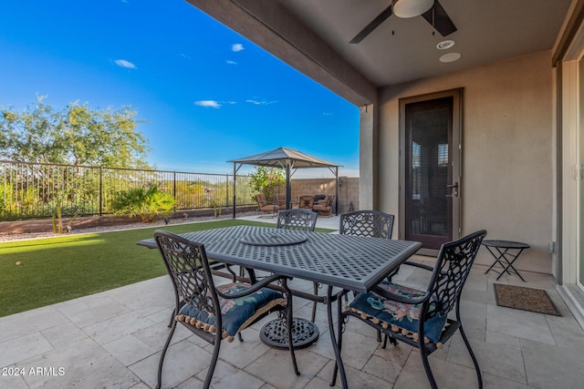 view of patio featuring a gazebo and ceiling fan