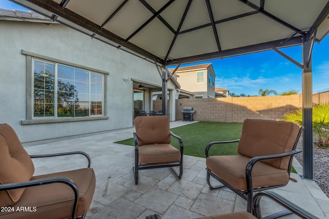 view of patio with a gazebo and a grill