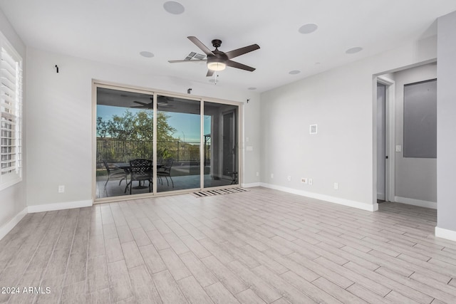 unfurnished room featuring ceiling fan and light hardwood / wood-style flooring