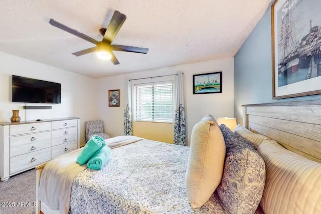carpeted bedroom with a ceiling fan