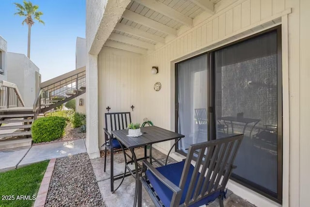 view of patio / terrace with stairs and outdoor dining space