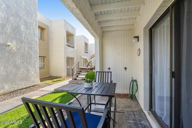balcony featuring outdoor dining area and a patio area
