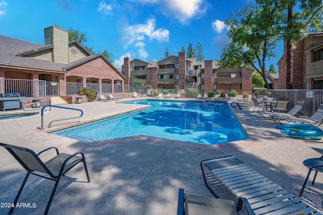 view of pool featuring a patio