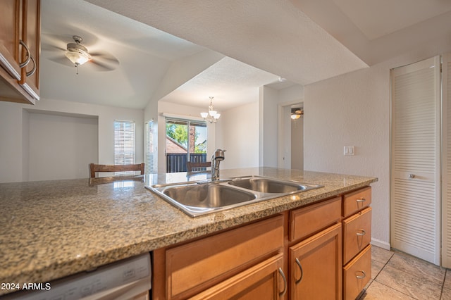 kitchen featuring light tile patterned floors, white dishwasher, vaulted ceiling, ceiling fan with notable chandelier, and sink